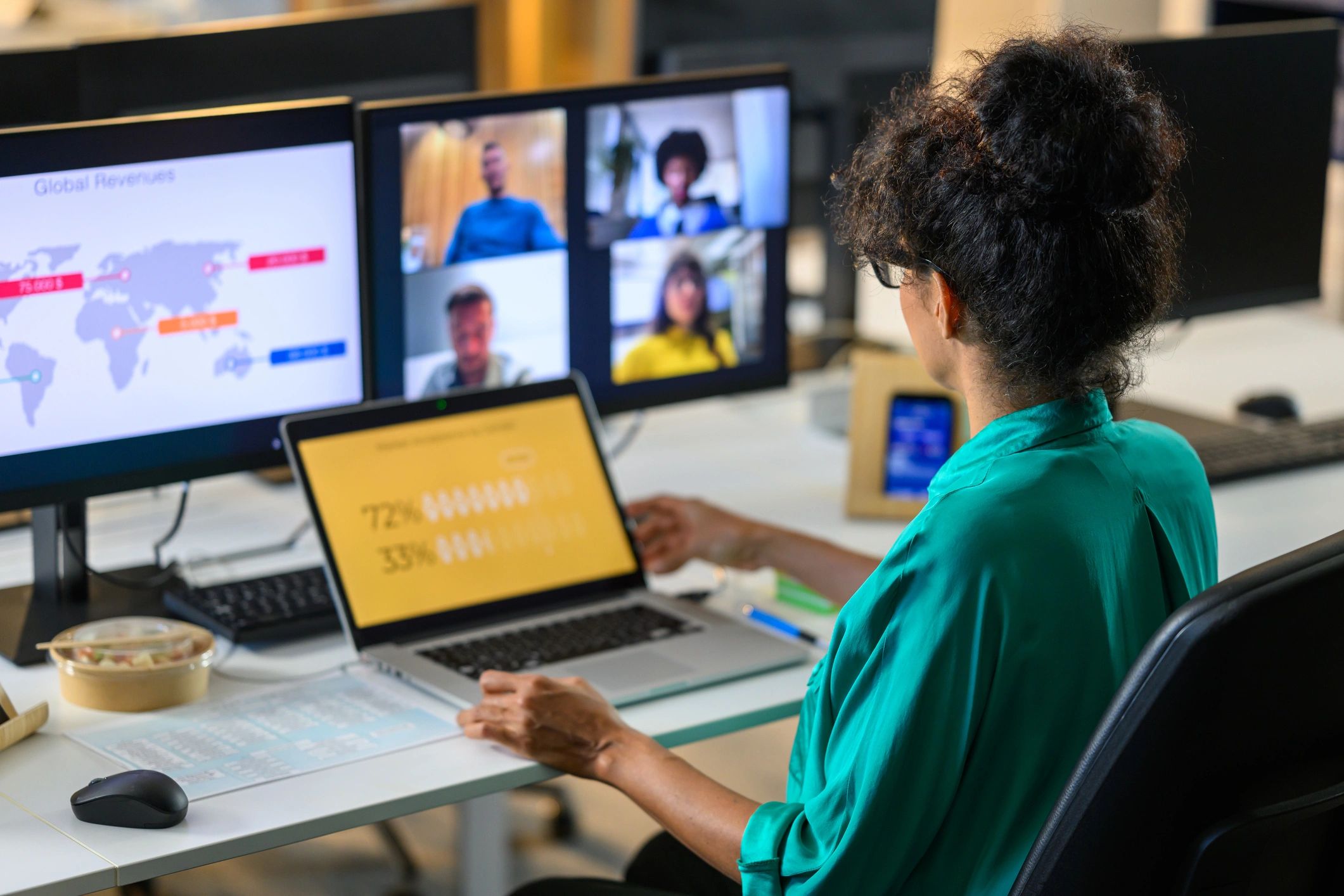 Woman discussing report with remote workers